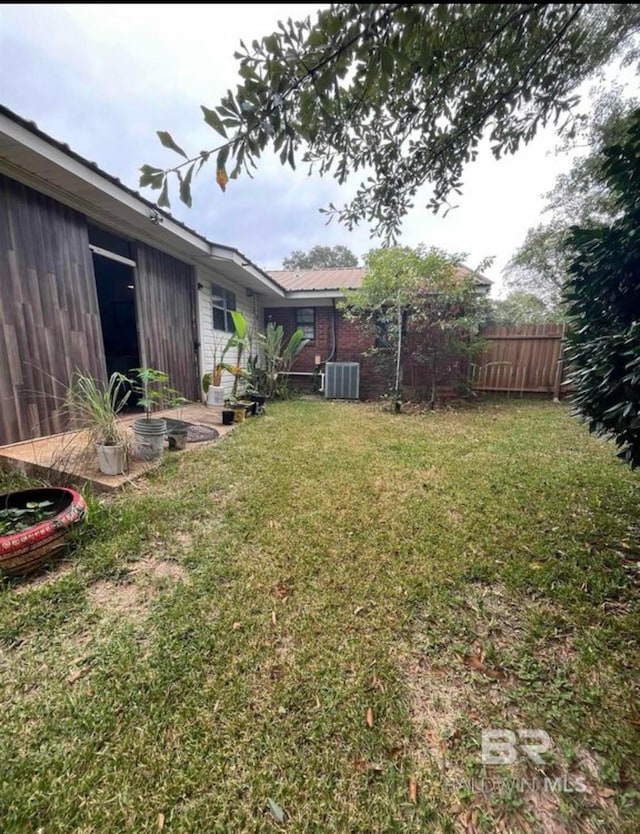 view of yard with central AC