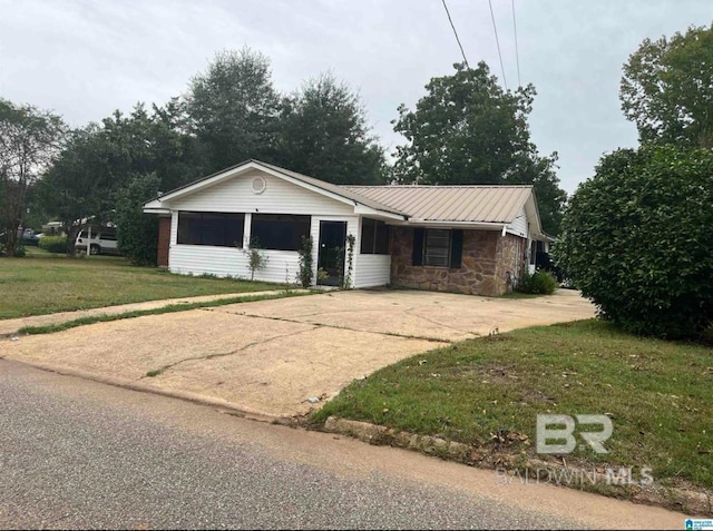 ranch-style house with a front lawn