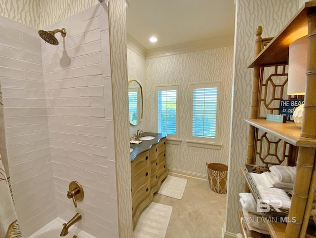 bathroom featuring vanity, baseboards, wallpapered walls, shower / bath combo with shower curtain, and crown molding