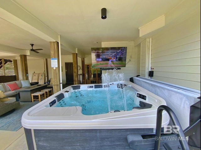 view of pool featuring a hot tub