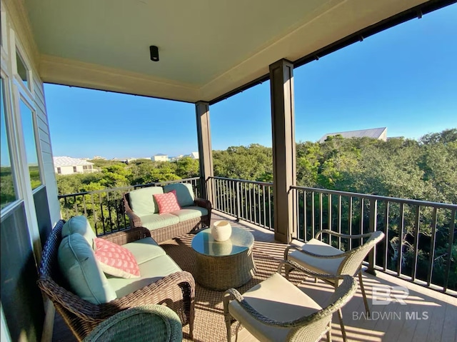 balcony with outdoor lounge area and a sunroom