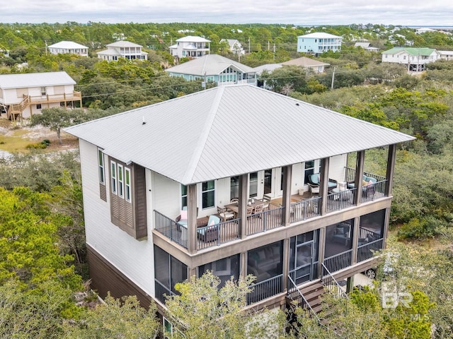 rear view of house with metal roof