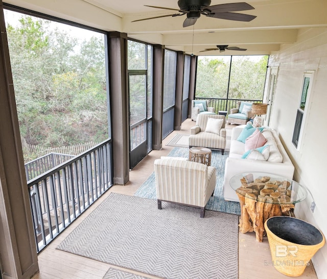 sunroom / solarium featuring beam ceiling