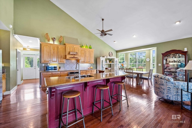 16288 Ferry Rd, Fairhope, AL 36532 - kitchen with ceiling fan, a sink, high vaulted ceiling, stainless steel microwave, and an island with sink