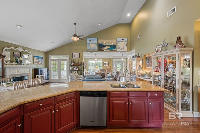 kitchen featuring dishwasher, ceiling fan, french doors, hardwood / wood-style floors, and sink