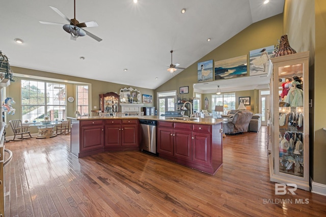 kitchen featuring ceiling fan, dishwasher, sink, and hardwood / wood-style flooring