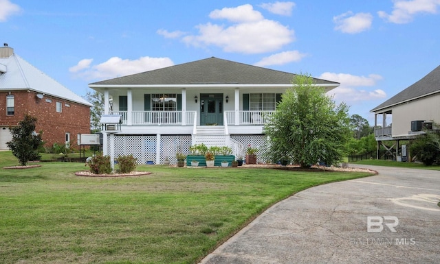 16288 Ferry Rd, Fairhope, AL 36532 - coastal inspired home with a porch, a shingled roof, a front lawn, and stairway