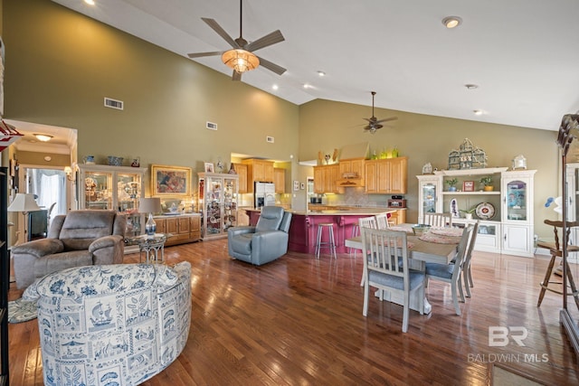 living room with high vaulted ceiling, ceiling fan, and hardwood / wood-style flooring