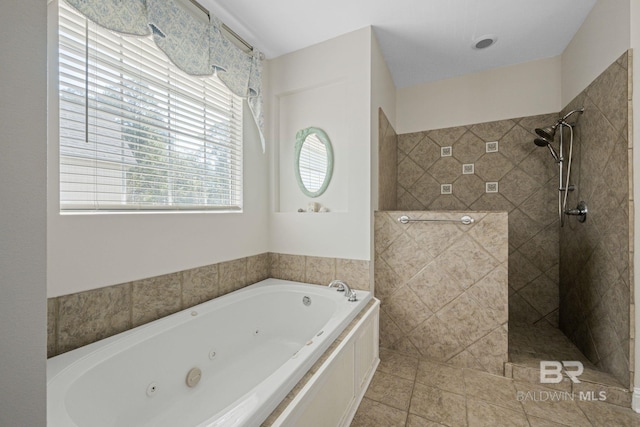 bathroom with shower with separate bathtub and tile patterned flooring