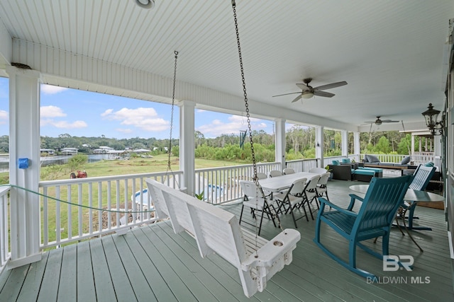 16288 Ferry Rd, Fairhope, AL 36532 - deck featuring an outdoor living space, a water view, ceiling fan, and outdoor dining space