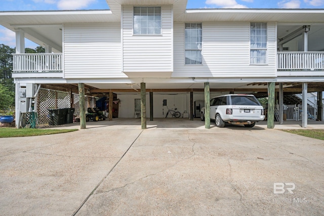 rear view of house featuring a carport