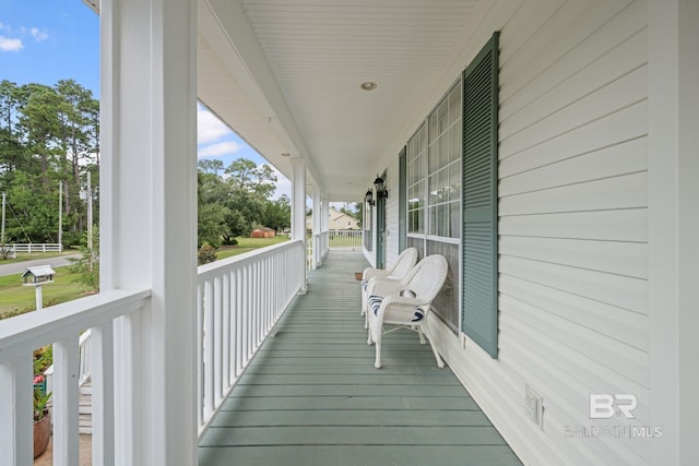 wooden terrace with a porch