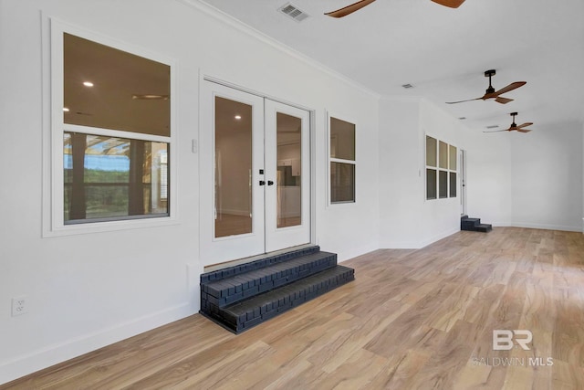 exterior space featuring ceiling fan, visible vents, and french doors