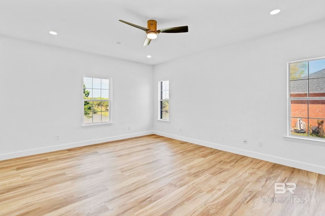 unfurnished room with a ceiling fan, recessed lighting, baseboards, and light wood-type flooring