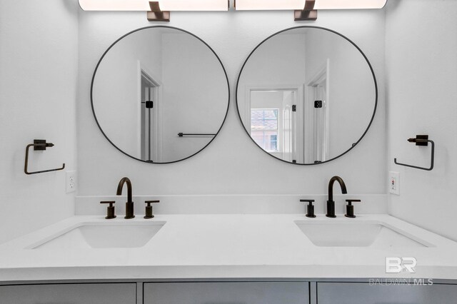 bathroom with double vanity and a sink