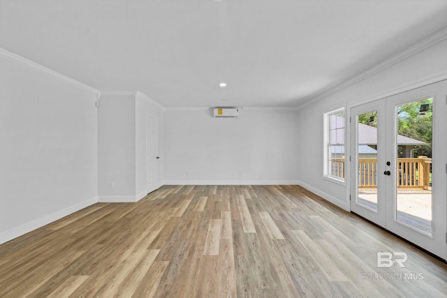 empty room featuring baseboards, ornamental molding, french doors, and light wood finished floors
