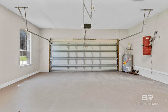 garage with a garage door opener, electric water heater, and baseboards