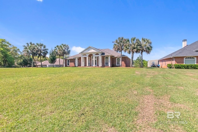 view of front of home with a front lawn