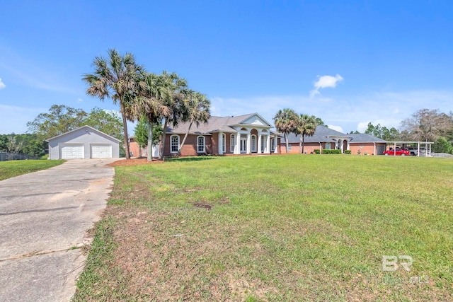 view of front of house with an outdoor structure, a detached garage, and a front lawn