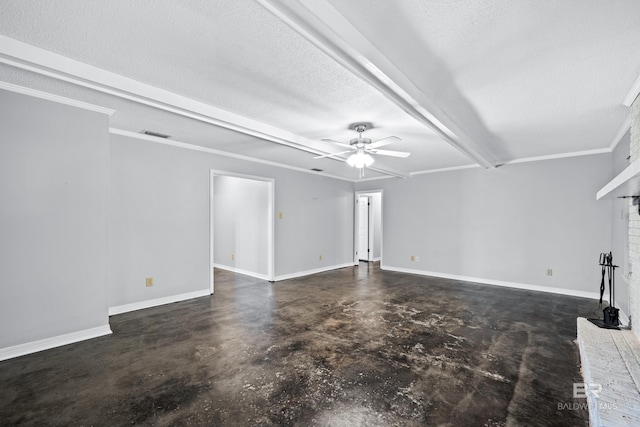 unfurnished living room featuring ceiling fan, a fireplace, a textured ceiling, ornamental molding, and beam ceiling