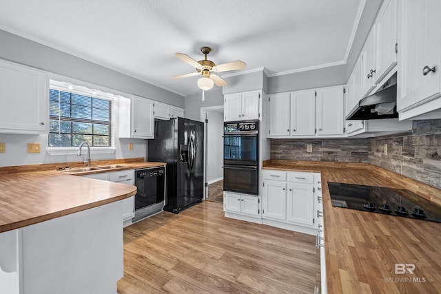 kitchen with black appliances, white cabinets, ceiling fan, and butcher block counters