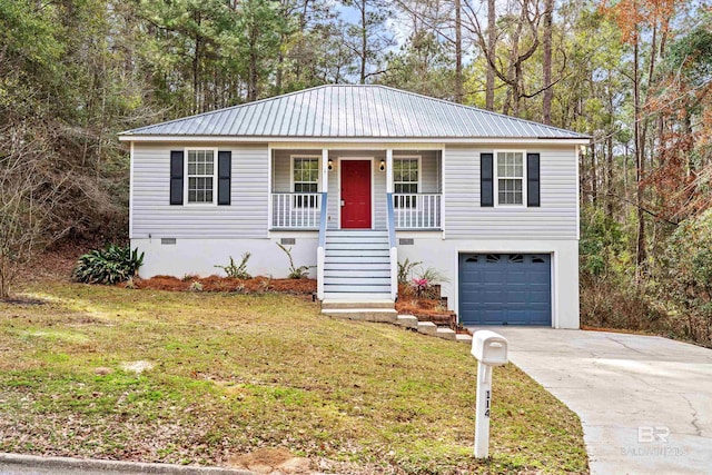 view of front of house with a garage, a front lawn, and a porch