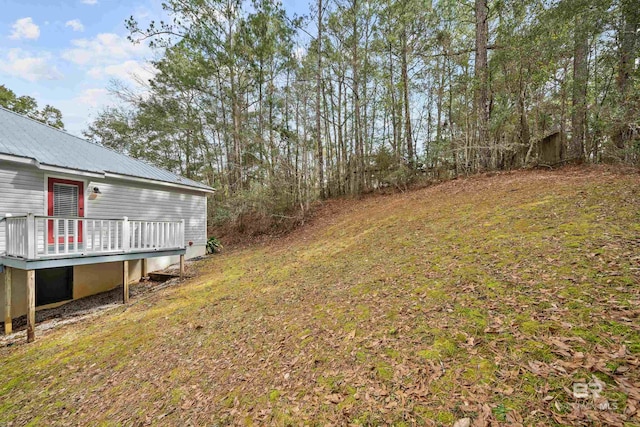 view of yard featuring a wooden deck