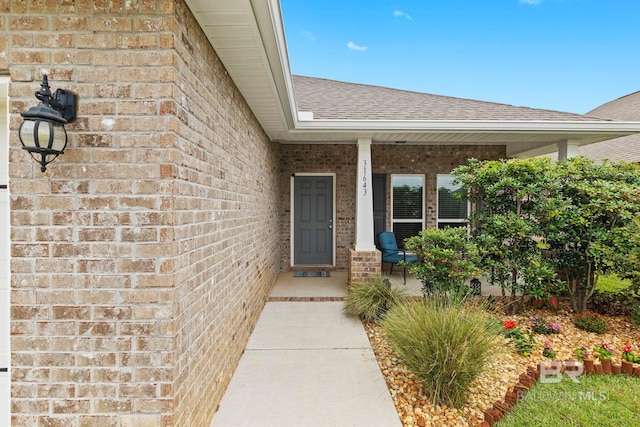 property entrance with covered porch