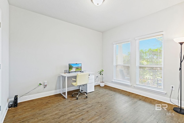 office space with hardwood / wood-style flooring