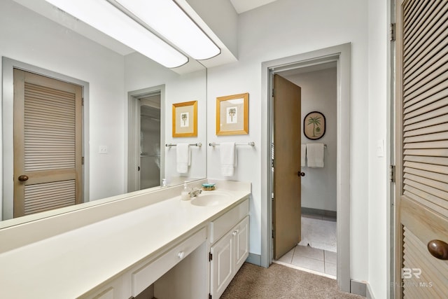 bathroom featuring tile patterned floors and vanity