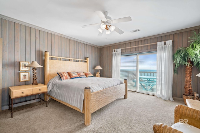bedroom with crown molding, access to outside, ceiling fan, and carpet flooring