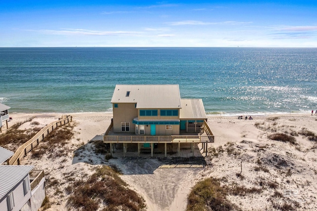 bird's eye view with a water view and a view of the beach
