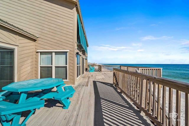 wooden deck featuring a water view