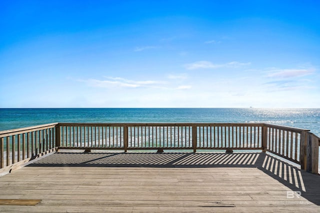 exterior space with a deck with water view