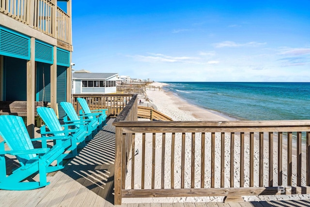deck featuring a water view and a view of the beach