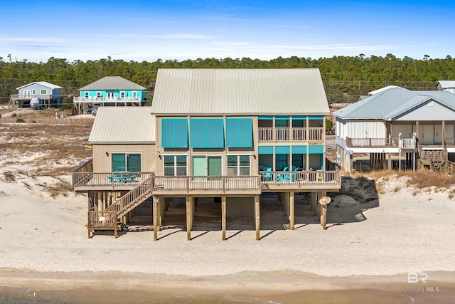 back of house featuring a deck