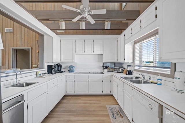 kitchen with sink, stainless steel dishwasher, dishwasher, and white cabinets