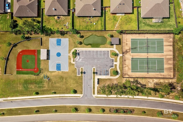 birds eye view of property with a residential view