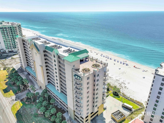 drone / aerial view with a beach view and a water view