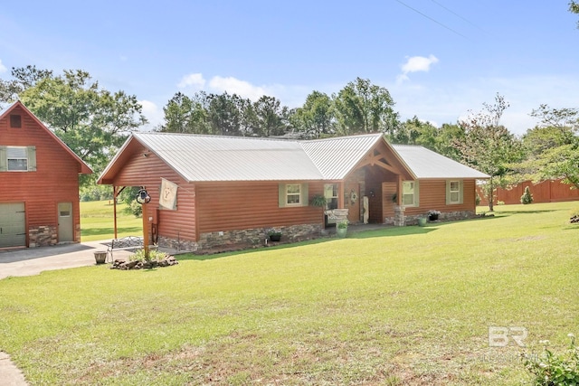 196 Jernigan Rd, Brewton, AL 36426 - view of front of home featuring a front lawn, metal roof, and faux log siding