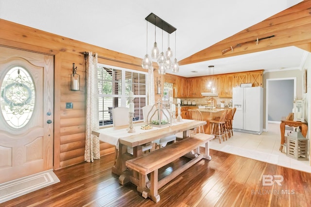 196 Jernigan Rd, Brewton, AL 36426 - dining area with light wood-style flooring, a chandelier, and vaulted ceiling
