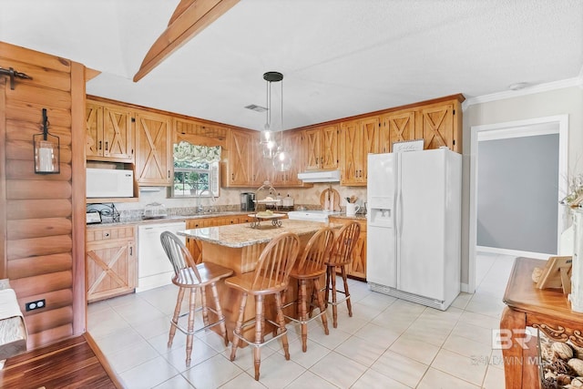 196 Jernigan Rd, Brewton, AL 36426 - kitchen with white appliances, under cabinet range hood, a sink, a center island, and decorative light fixtures