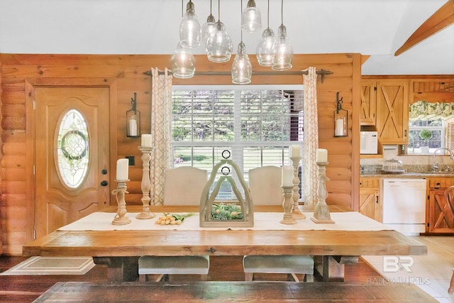 196 Jernigan Rd, Brewton, AL 36426 - dining space featuring log walls and plenty of natural light