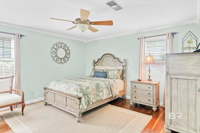 196 Jernigan Rd, Brewton, AL 36426 - bedroom featuring wood finished floors, ornamental molding, baseboards, and a ceiling fan