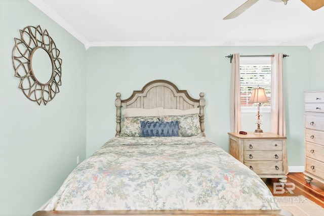 196 Jernigan Rd, Brewton, AL 36426 - bedroom featuring dark wood-type flooring, ornamental molding, a ceiling fan, and baseboards