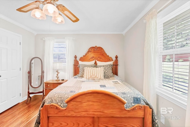 196 Jernigan Rd, Brewton, AL 36426 - bedroom with wood finished floors, ornamental molding, baseboards, and ceiling fan