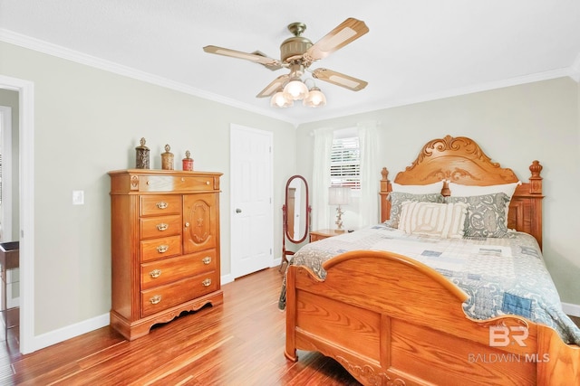 196 Jernigan Rd, Brewton, AL 36426 - bedroom with crown molding, light wood-type flooring, baseboards, and a ceiling fan