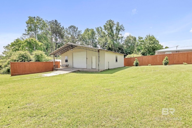 196 Jernigan Rd, Brewton, AL 36426 - rear view of house with an outbuilding and a detached garage