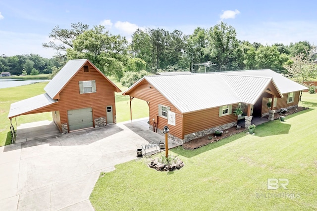196 Jernigan Rd, Brewton, AL 36426 - view of front of property with driveway, a front yard, a water view, and stone siding