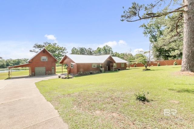 196 Jernigan Rd, Brewton, AL 36426 - view of yard featuring a garage, concrete driveway, and an outdoor structure